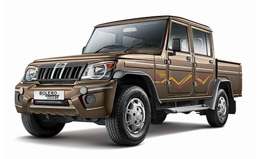 Mahindra Bolero Camper A chocolate colour Bolero Camper pickup with dual tone finish designed for tough road conditions