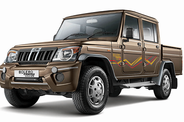 Mahindra Bolero Camper 4WD A brown Mahindra Bolero Camper 4WD with off-road driving capabilities and strong suspension
