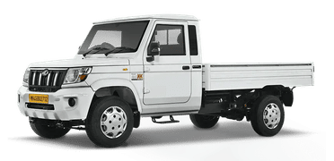 A white compact Mahindra Bolero Maxx Pickup City mini truck with efficient load capacity