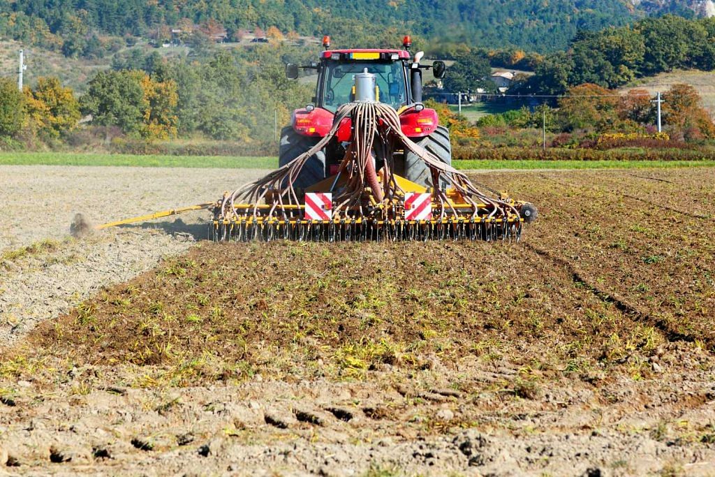 Tractor working in agriculture field