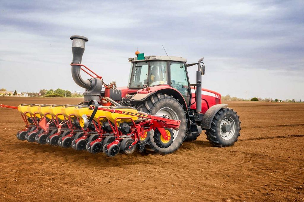 Tractor working in field